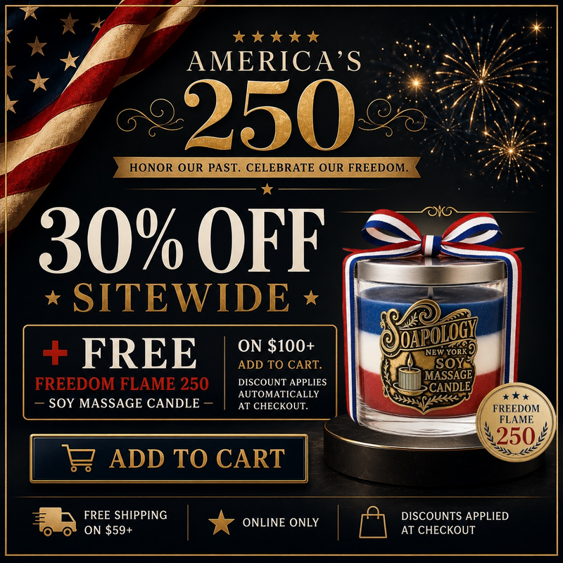 Freedom Flame 250 patriotic triple-layer soy massage candle by Soapology New York with blue, white, and red wax, gold metal label, silver lid, and red, white, and blue ribbon celebrating America’s 250th anniversary.